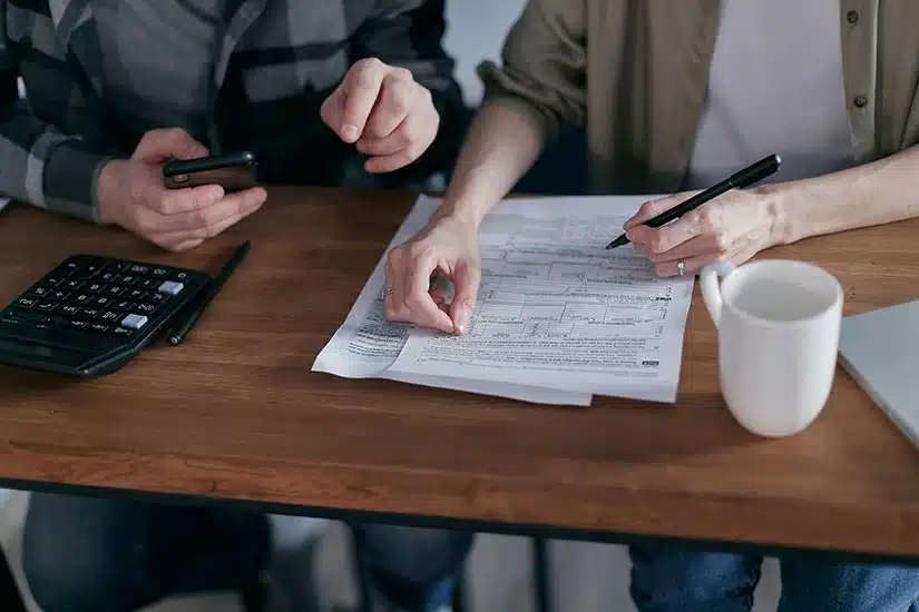 Couple filling out tax form
