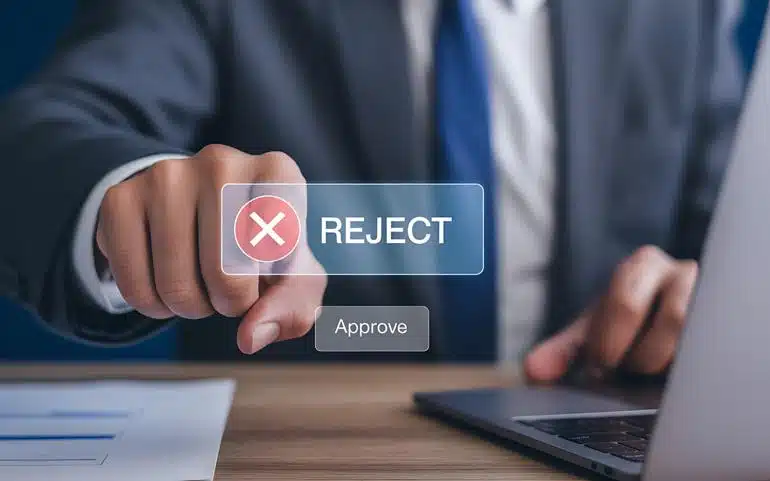 Businessman’s hand pressing the reject button on a virtual interface