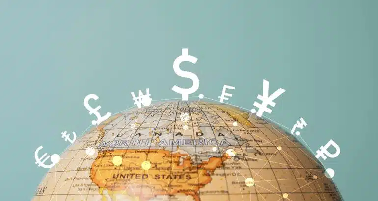 A globe showing Canada and the United States with various currency symbols superimposed around the top of the globe
